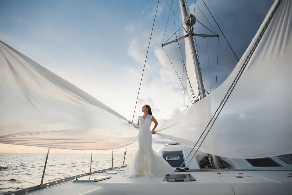 happy-bride-yacht-white-yacht-with-sail-set-goes-along-island